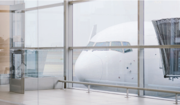 Airplane seen through terminal windows